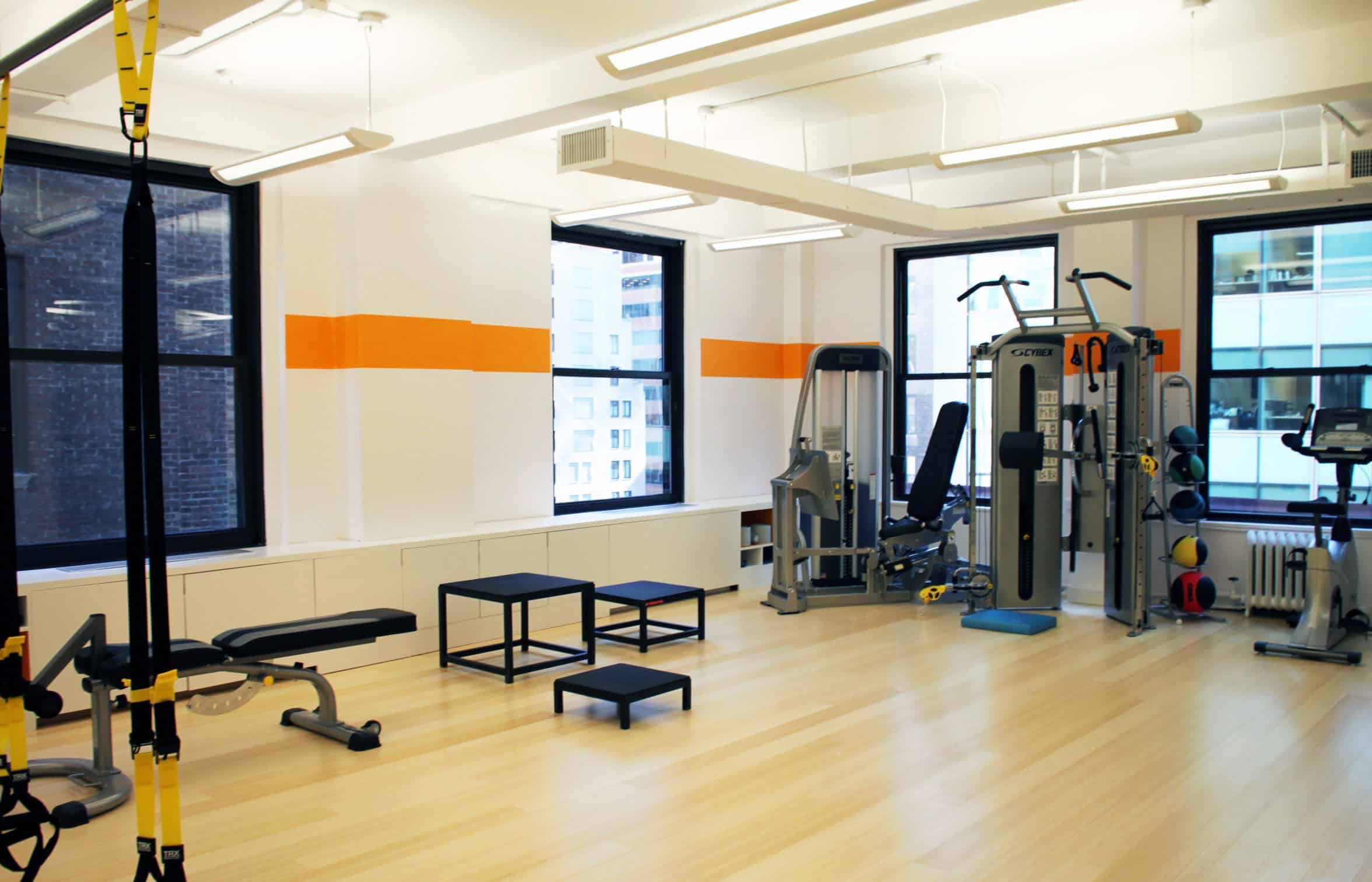Gym space in commercial office renovation by EXD Architecture